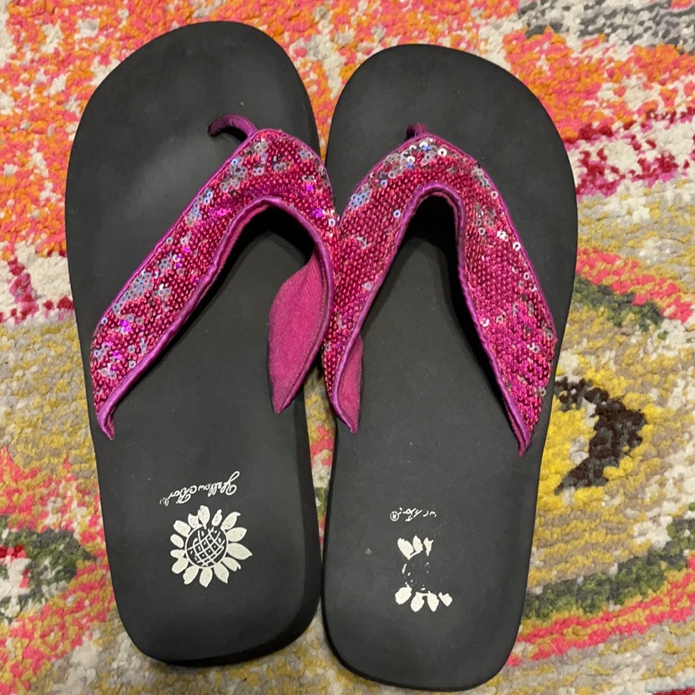 Purple shiny flip-flops